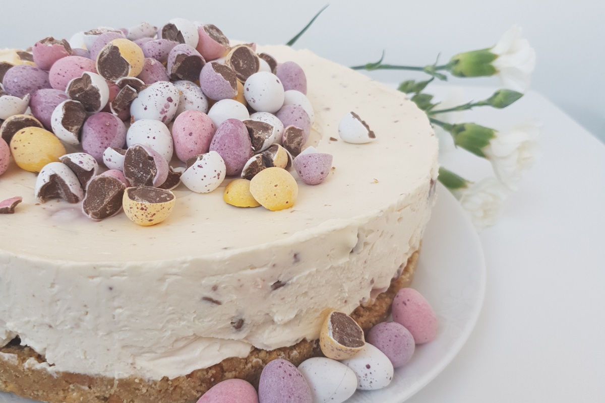 Easter egg cheesecake Easter egg cheesecake topped with mini chocolate eggs and festive sprinkles.